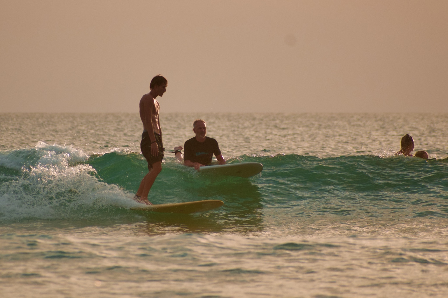 Surfing in the golden light of Costa Rica